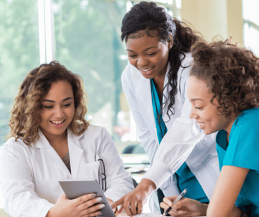 Two Peer Mentors with student nurse