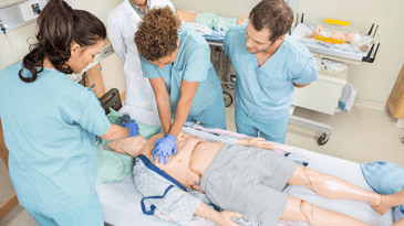 Student nurses practice on a maniki