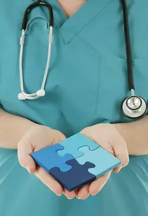 Nurse_Holding_Assembled_Puzzle